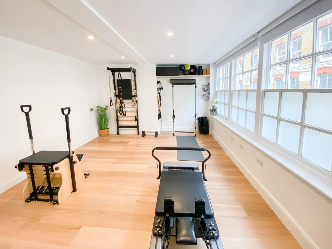 Bright Pilates studio with a Reformer, Wunda Chair and space for movement